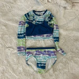 Tie-dye two-piece, bathing suit with a cover-up shirt that’s a bathing suit